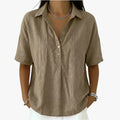 Women's oversized short sleeve collared blouse with button front and rounded hem