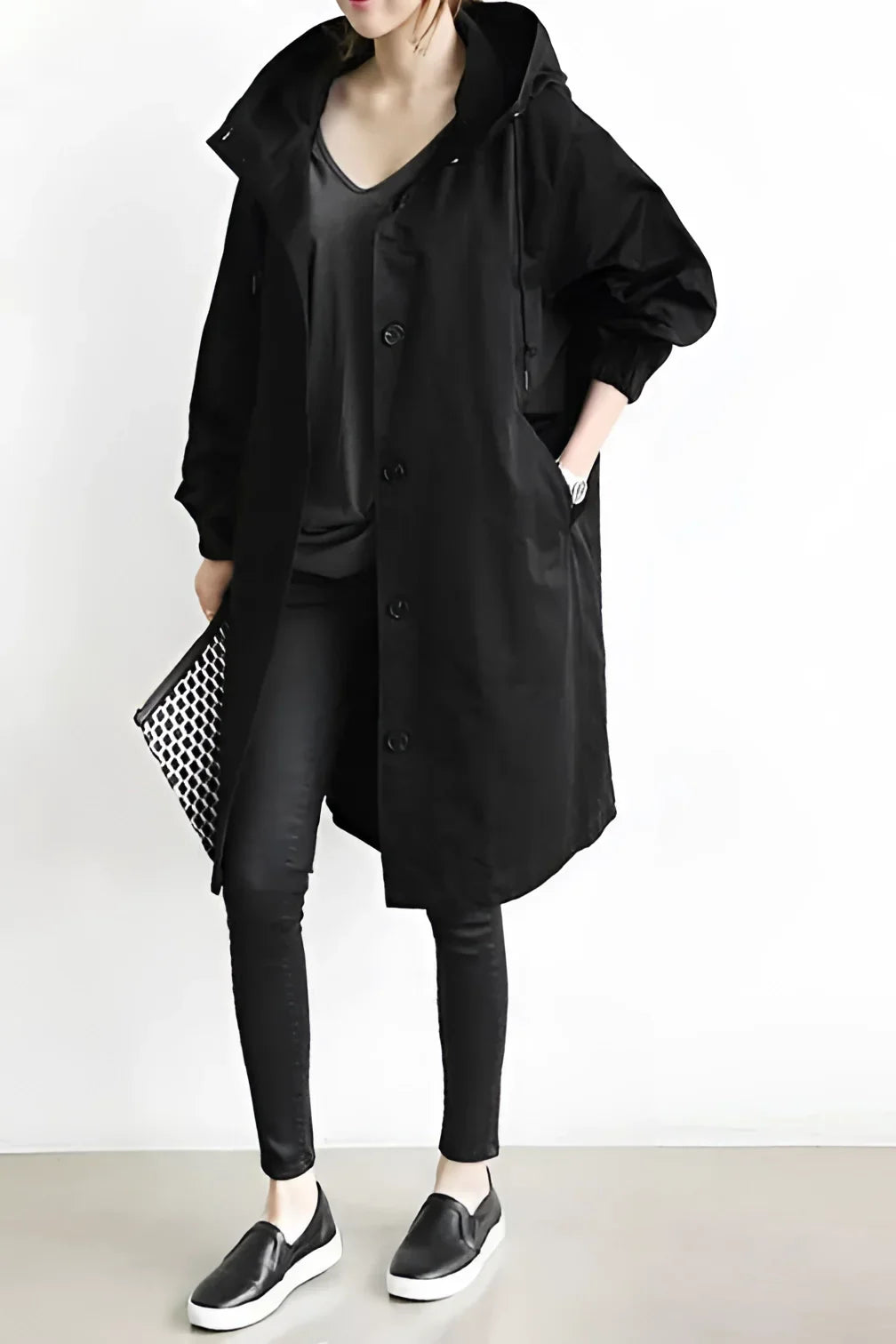 Women's long hooded trench coat with button front and gathered cuffs