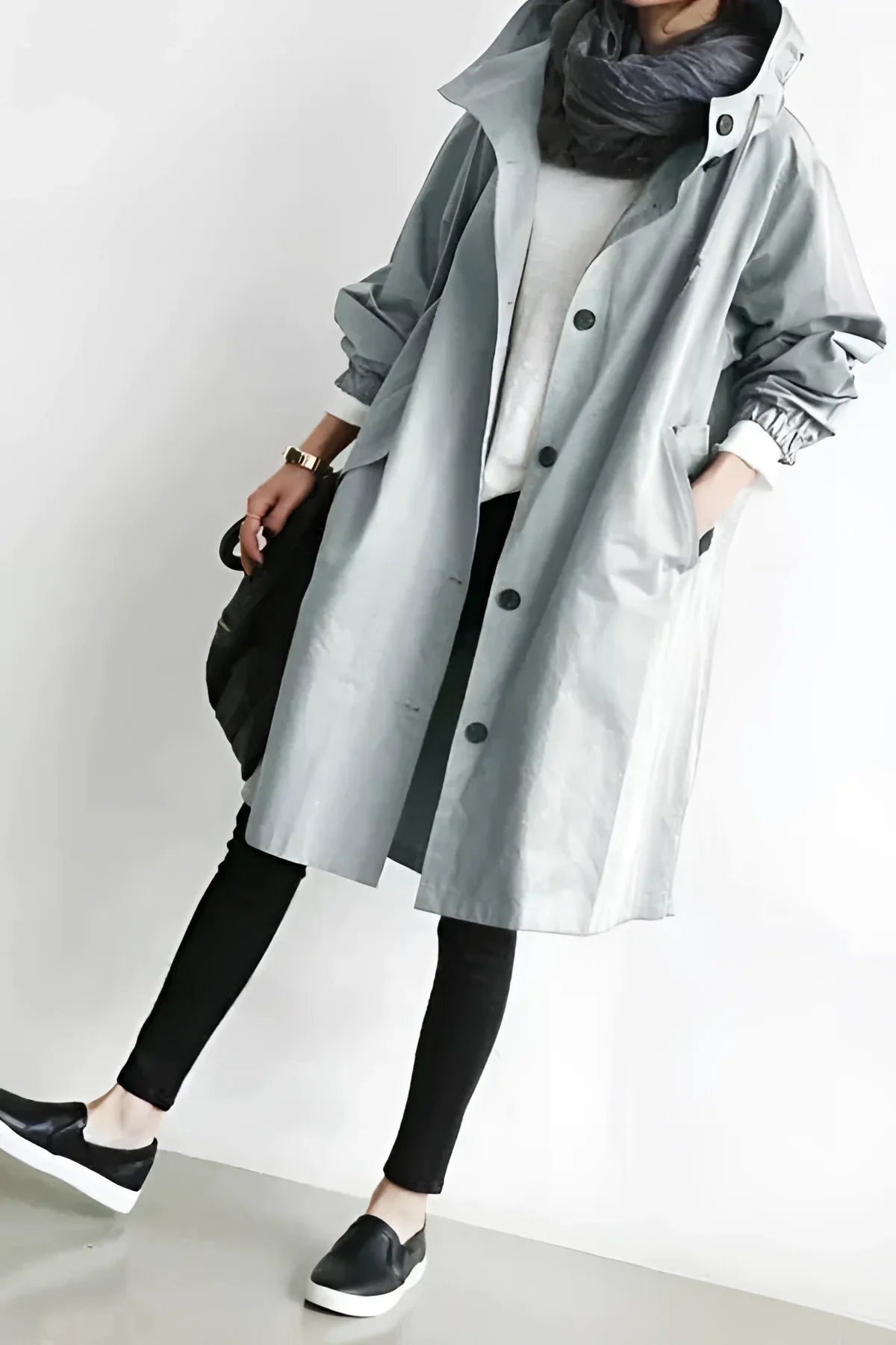 Women's long hooded trench coat with button front and gathered cuffs