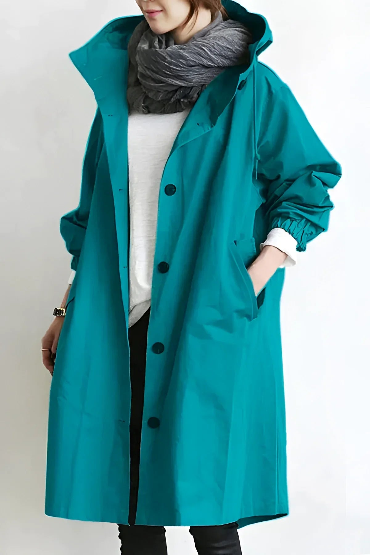 Women's long hooded trench coat with button front and gathered cuffs