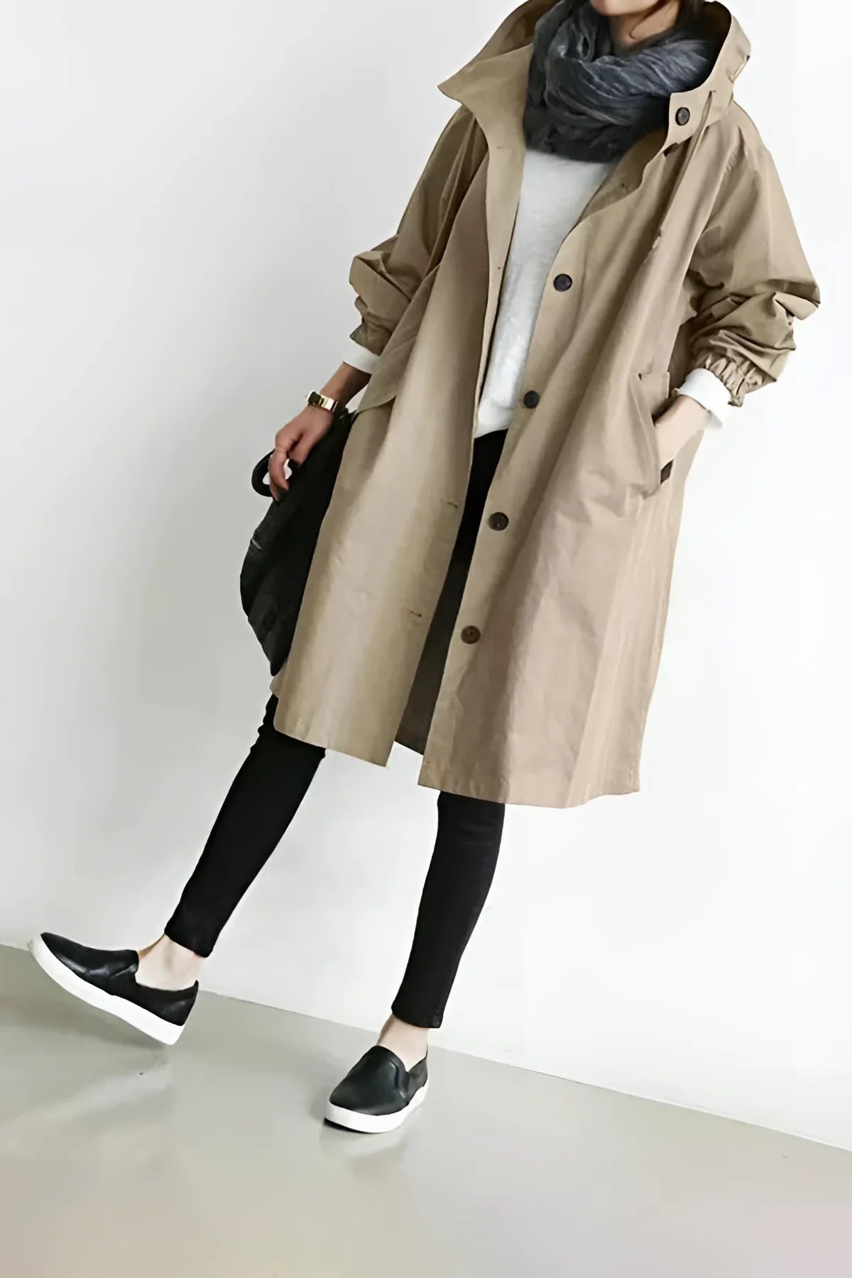 Women's long hooded trench coat with button front and gathered cuffs