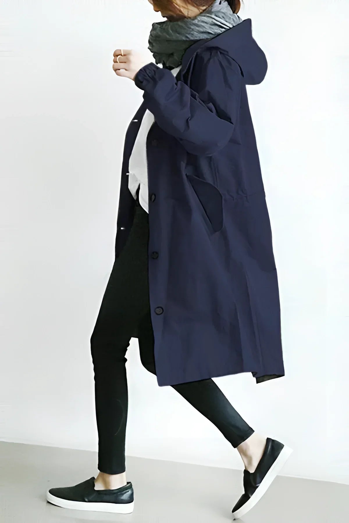 Women's long hooded trench coat with button front and gathered cuffs