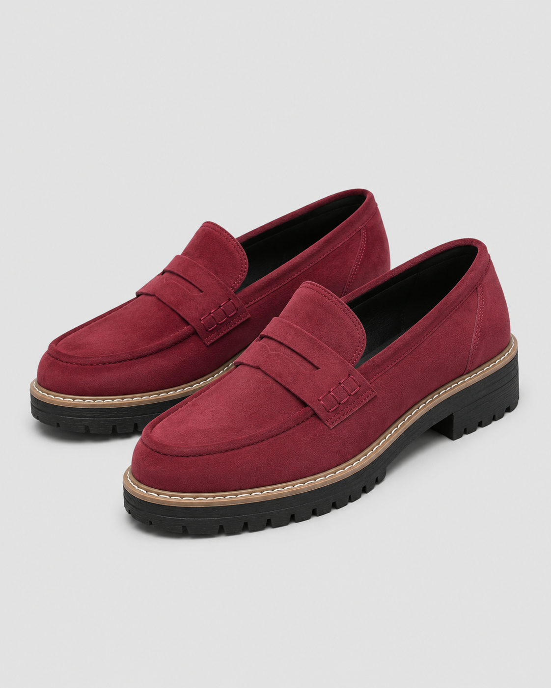 Women's slip-on loafers with penny straps, round toes and lug soles