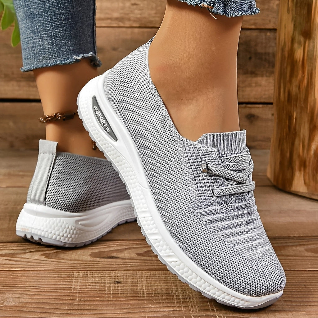 Women's grey textured lace-up trainers with round toes and white flat soles