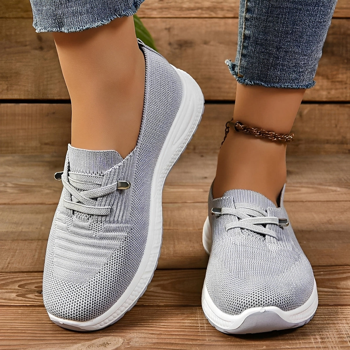 Women's grey textured lace-up trainers with round toes and white flat soles