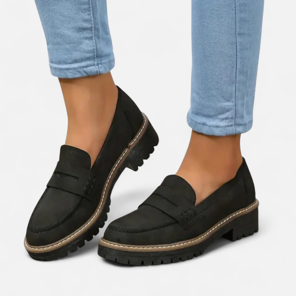 Women's slip-on loafers with penny straps, round toes and lug soles