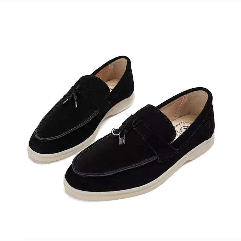 Women's slip-on loafers with almond toes, vamp straps and flat soles