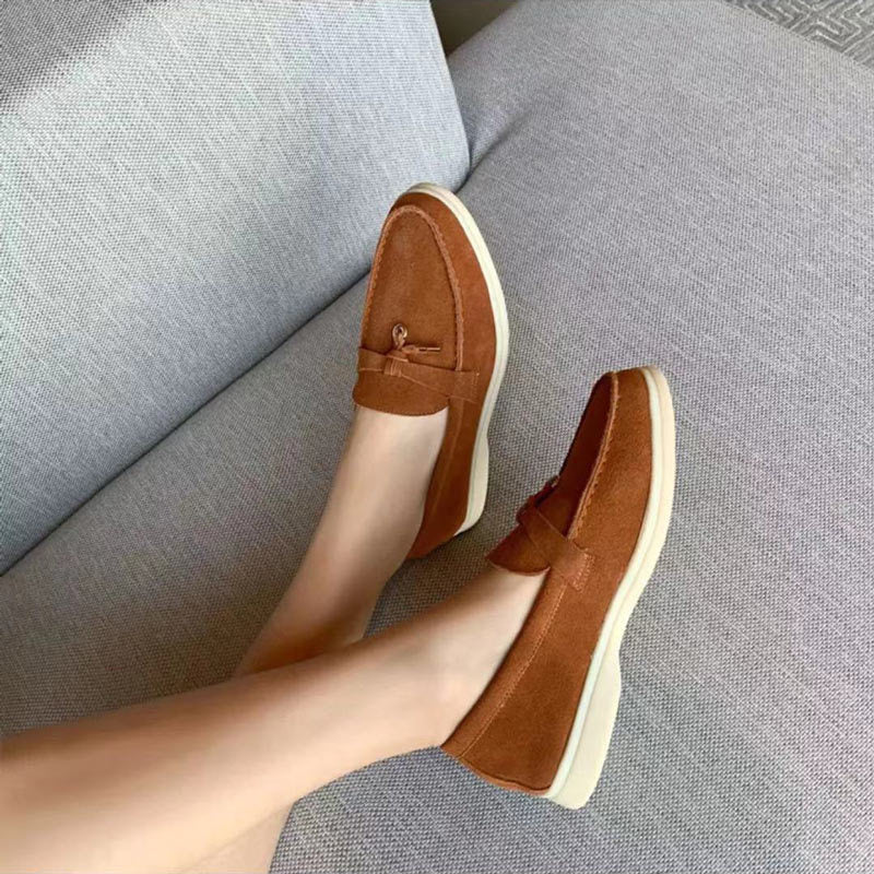 Women's slip-on loafers with almond toes, vamp straps and flat soles