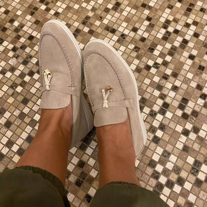Women's slip-on loafers with almond toes, vamp straps and flat soles