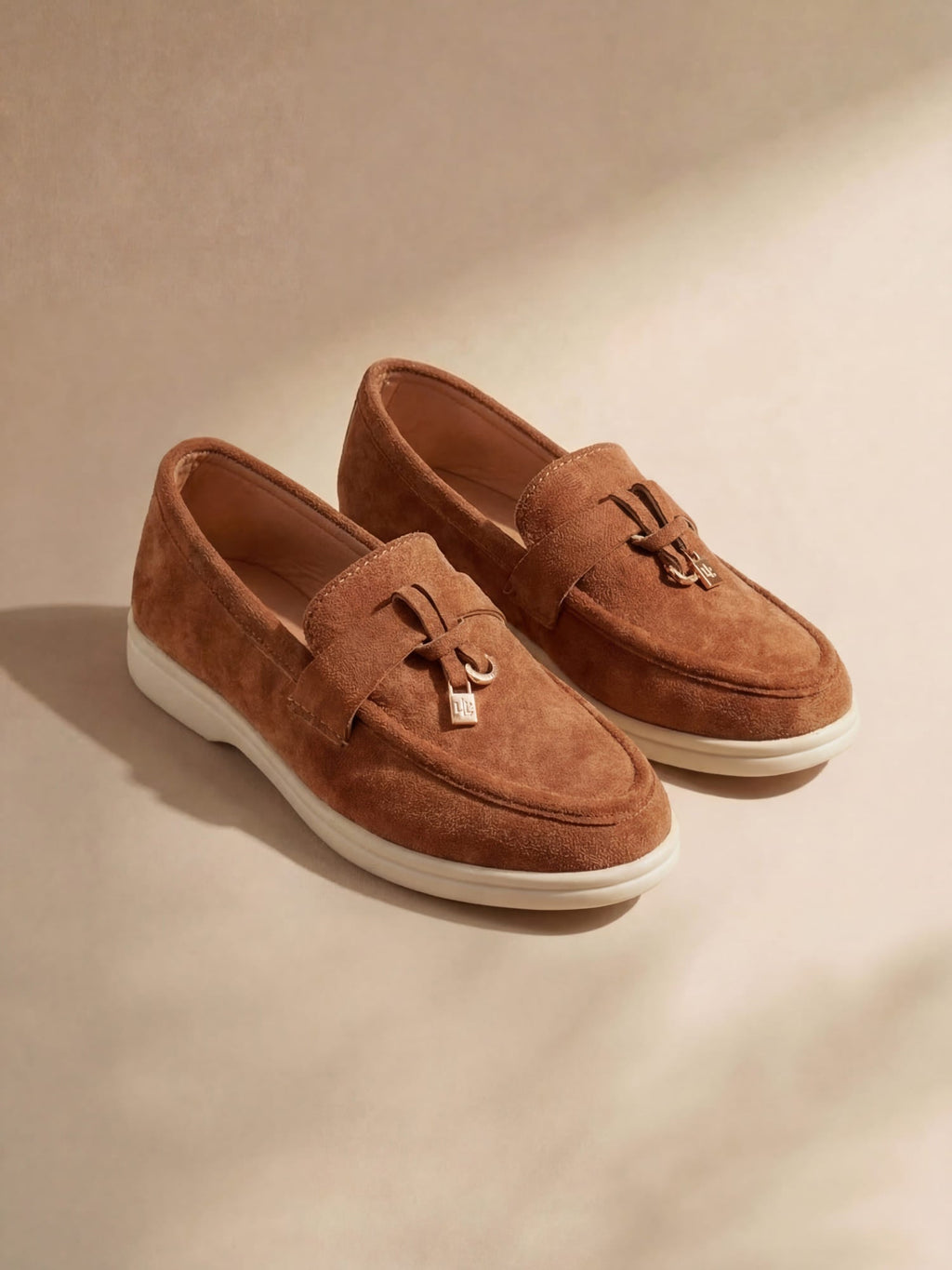Women's slip-on loafers with almond toes, vamp straps and flat soles