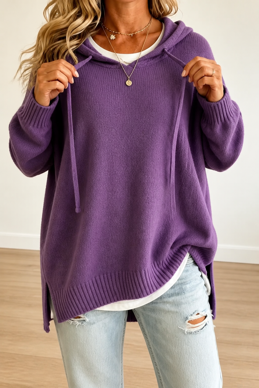 Women's oversized hooded knit sweater with drawstring ties and ribbed edges