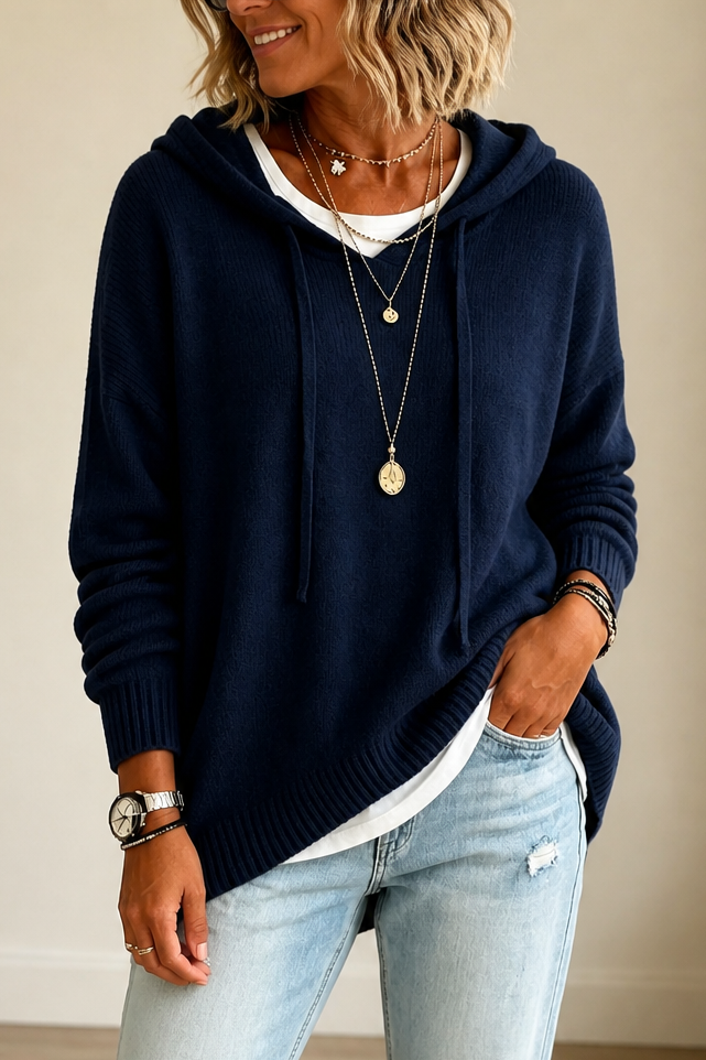 Women's oversized hooded knit sweater with drawstring ties and ribbed edges